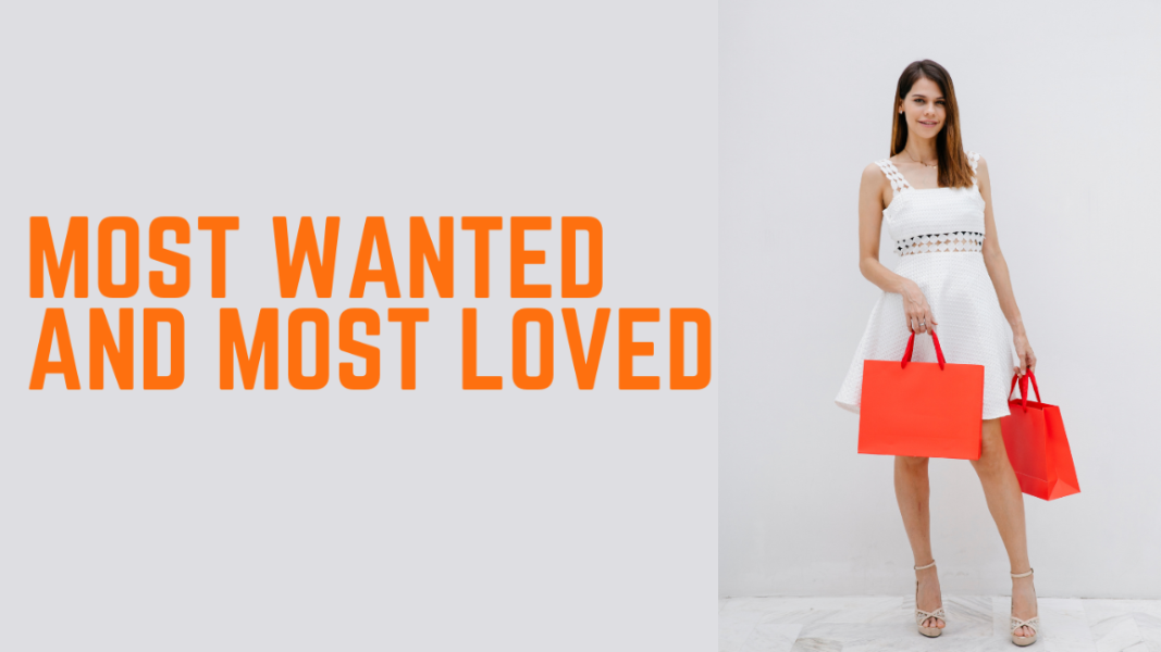 Woman holding two red handbags with text 'Most Wanted and Most Loved' on a white background